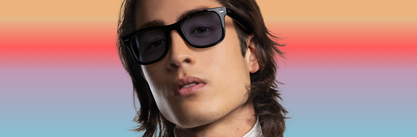 Blog banner with model in the centre showcase Transitions Gen s lenses.
